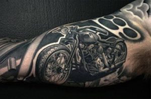 black_motorcycle_and_brass_knuckles_forearm_tattoo